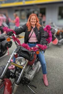 a woman on a Harley Davidson motorbike